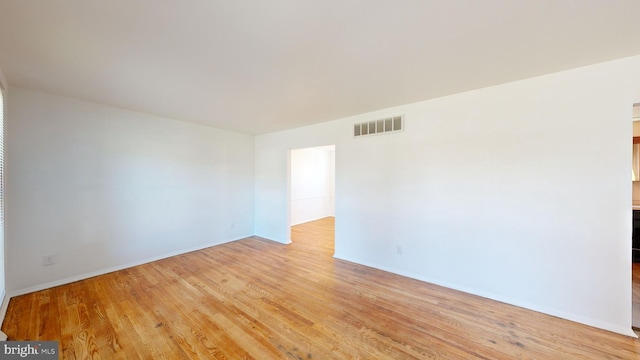 spare room with light wood-type flooring