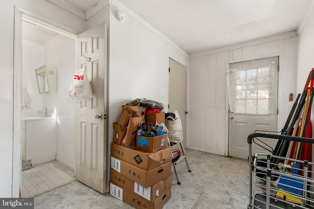 foyer featuring crown molding