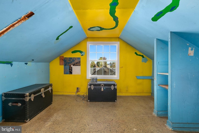 additional living space featuring vaulted ceiling