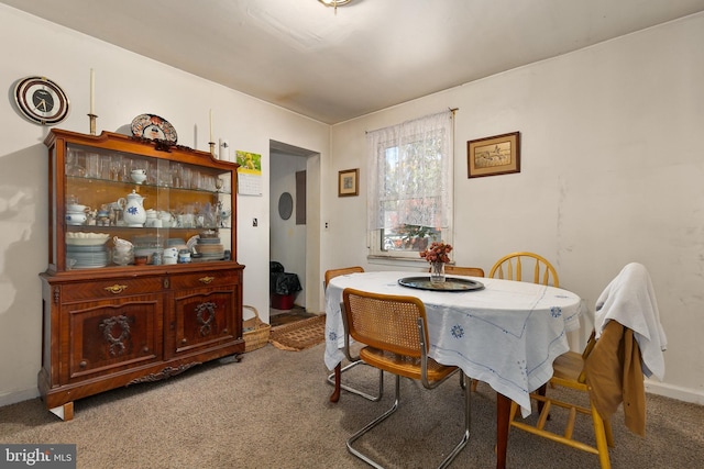 dining space featuring carpet flooring