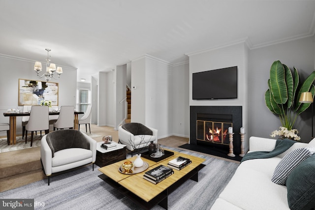 living room with crown molding and a chandelier