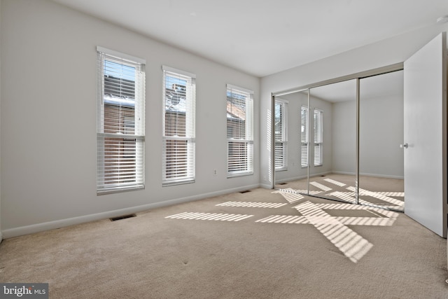 view of carpeted spare room