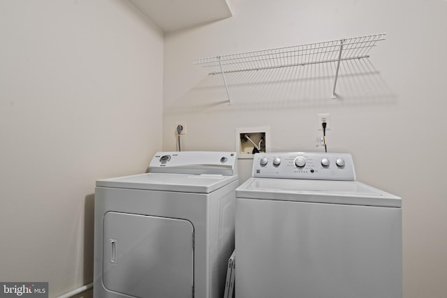 laundry area with separate washer and dryer