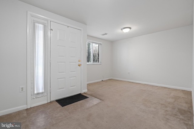 entryway with light carpet