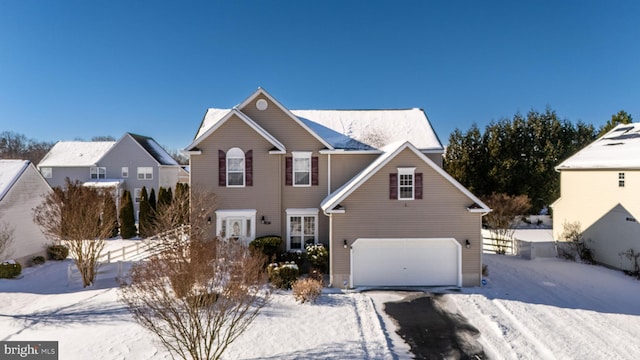 view of front of property featuring a garage