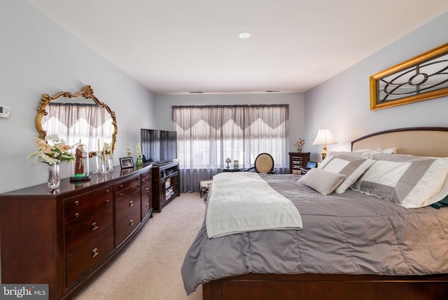 bedroom with light carpet