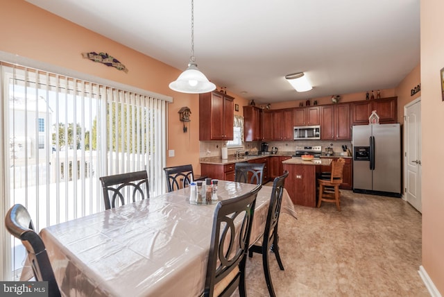 dining area featuring sink