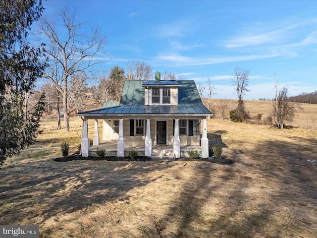 view of front of house with a porch and a front yard