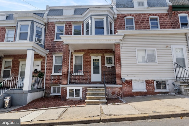 multi unit property featuring a porch