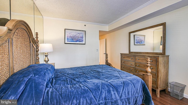 bedroom with crown molding, dark hardwood / wood-style flooring, and a textured ceiling