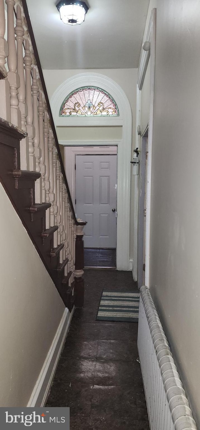 foyer entrance featuring radiator