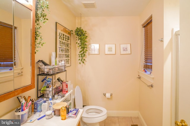 bathroom featuring tile patterned flooring and toilet