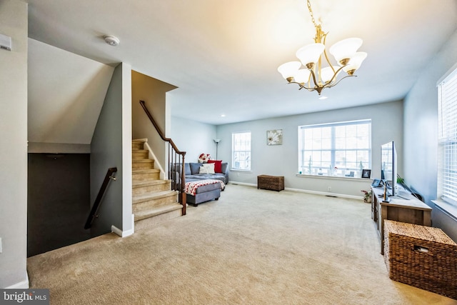 sitting room with light colored carpet and a notable chandelier