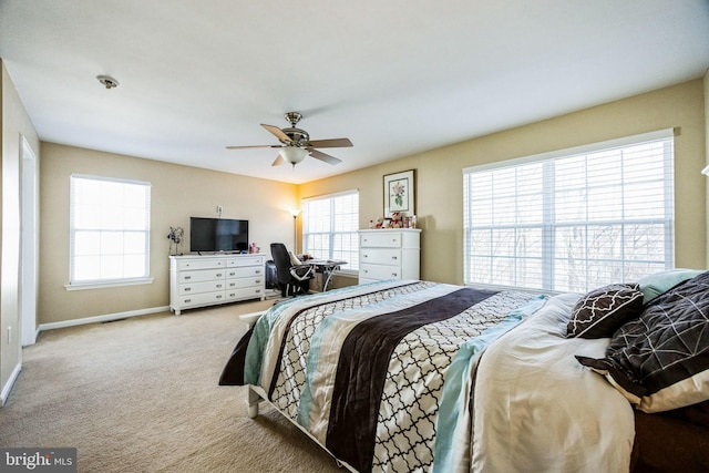 bedroom with ceiling fan and light colored carpet