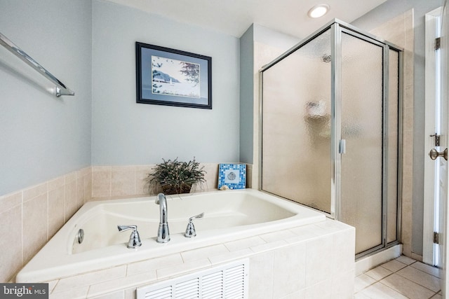 bathroom with tile patterned flooring and plus walk in shower