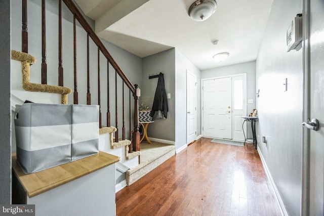 foyer entrance featuring hardwood / wood-style floors