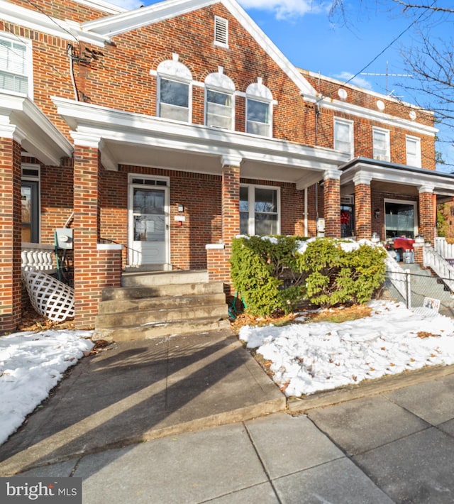 townhome / multi-family property with covered porch