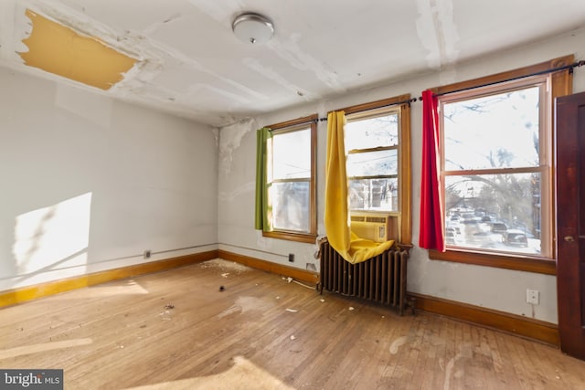 interior space featuring hardwood / wood-style floors and radiator