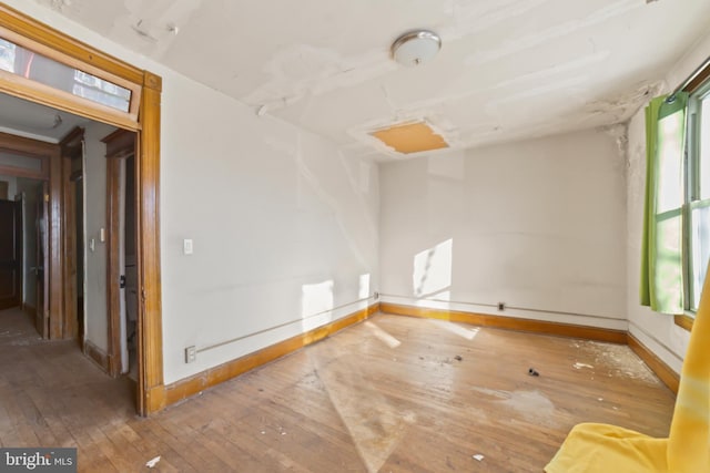 empty room featuring wood-type flooring