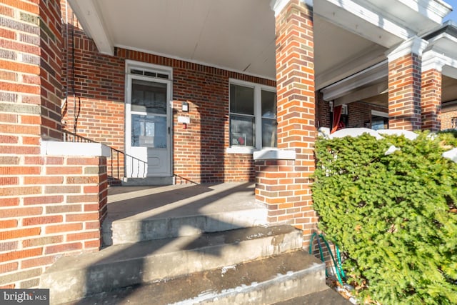 doorway to property with a porch