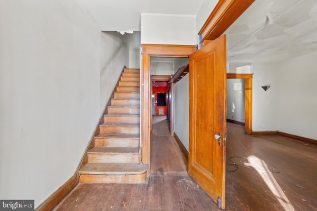 stairs with wood-type flooring