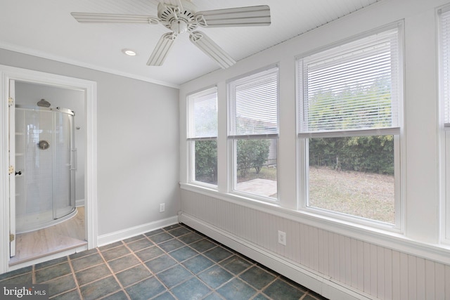 unfurnished sunroom featuring baseboard heating and ceiling fan