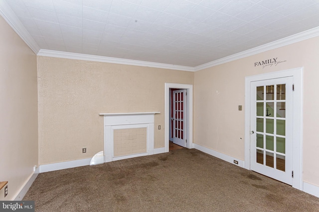 carpeted empty room with crown molding and a fireplace