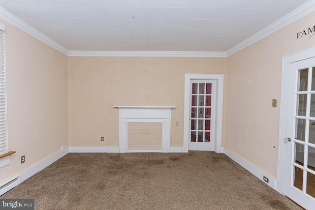 unfurnished living room with a baseboard heating unit, crown molding, carpet floors, and a fireplace