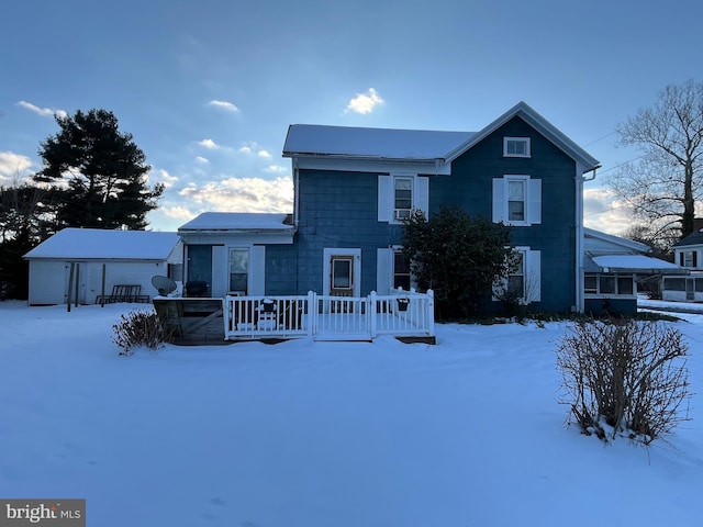 view of front facade with a wooden deck