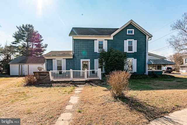 front facade featuring a front lawn and a deck