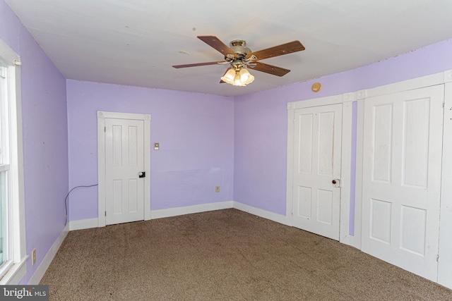 unfurnished bedroom featuring carpet flooring and ceiling fan