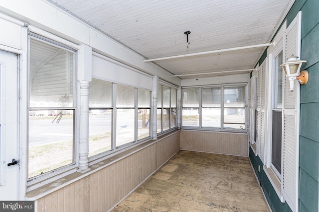 unfurnished sunroom with a wealth of natural light