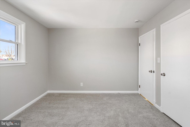 empty room featuring light colored carpet