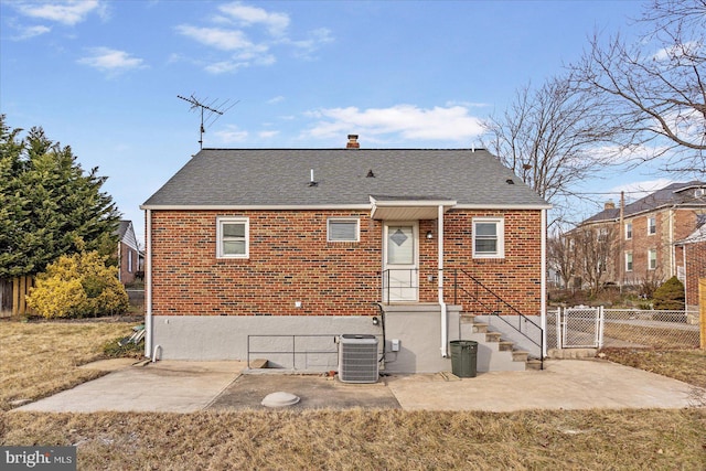 back of house featuring cooling unit and a patio area