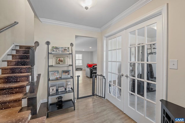 interior space featuring french doors, crown molding, and light hardwood / wood-style floors