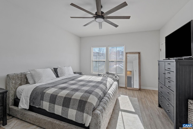 bedroom featuring ceiling fan and light wood-type flooring