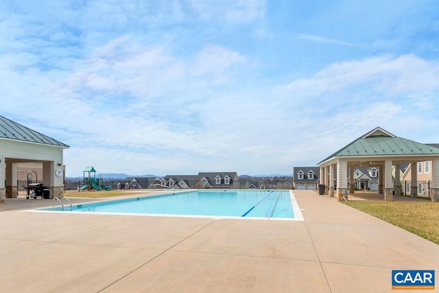 view of swimming pool featuring a patio