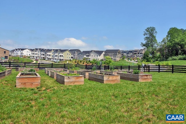 view of home's community with a yard