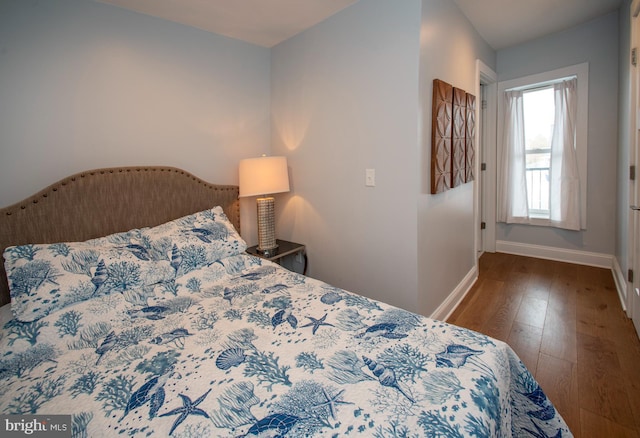 bedroom with hardwood / wood-style flooring