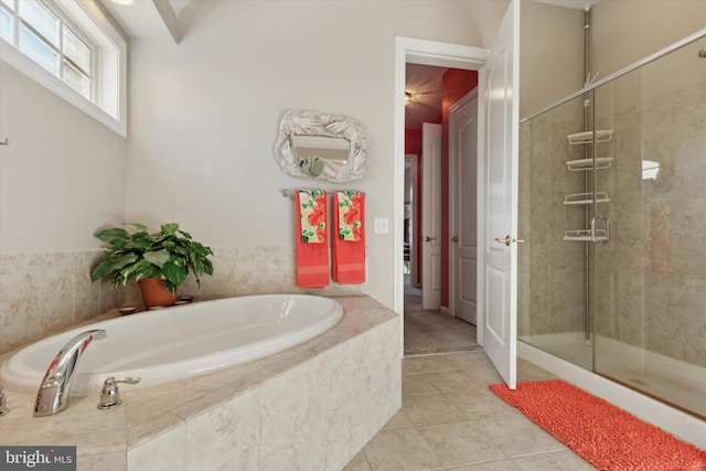 bathroom featuring shower with separate bathtub and tile patterned floors