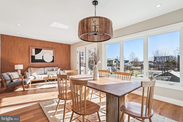 dining area featuring french doors and light hardwood / wood-style flooring