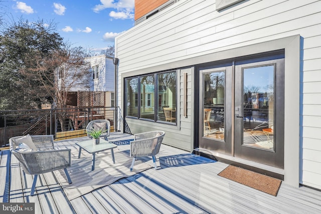 wooden terrace featuring french doors