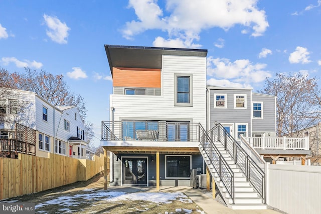 back of house with a wooden deck