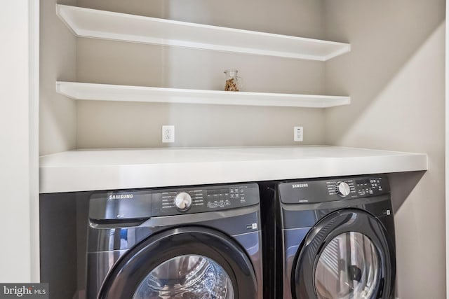 clothes washing area featuring washing machine and clothes dryer