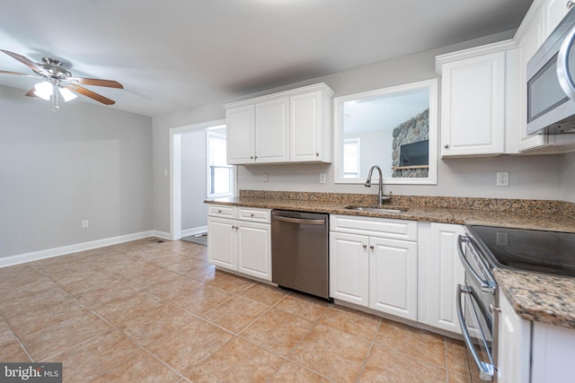 kitchen featuring stainless steel appliances, sink, and white cabinets