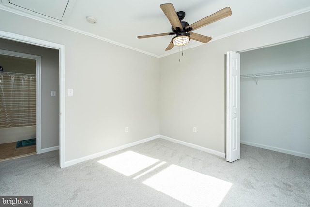 unfurnished bedroom with crown molding, light carpet, ceiling fan, and a closet