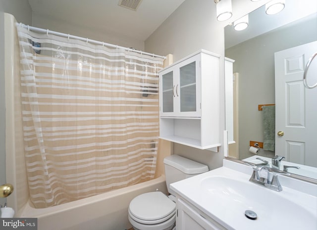 full bathroom featuring toilet, vanity, and shower / bath combo with shower curtain