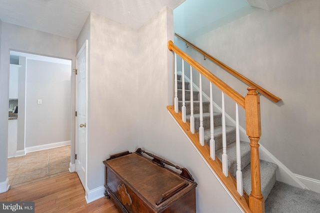 staircase featuring hardwood / wood-style floors