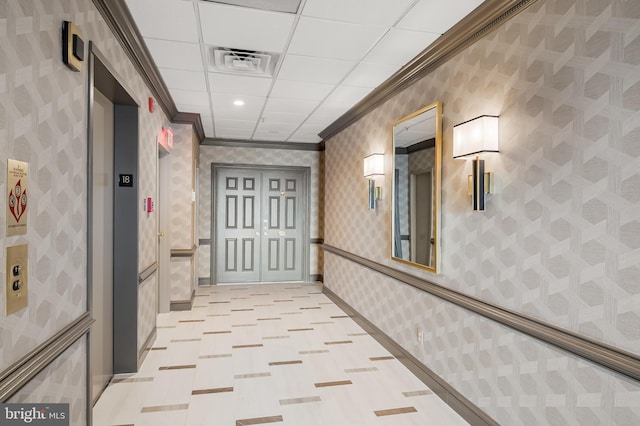 corridor with elevator and crown molding