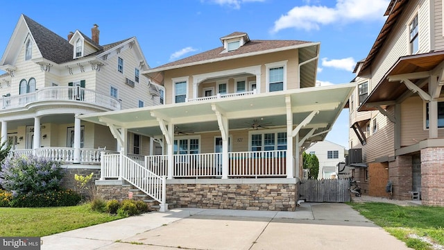 view of front of property featuring central air condition unit, ceiling fan, and a porch